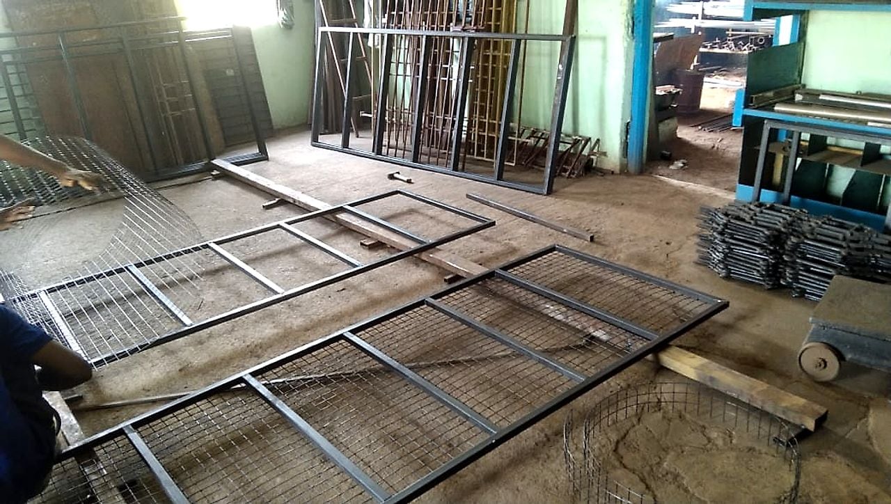 Assembly yard — gates and grills in fit-up